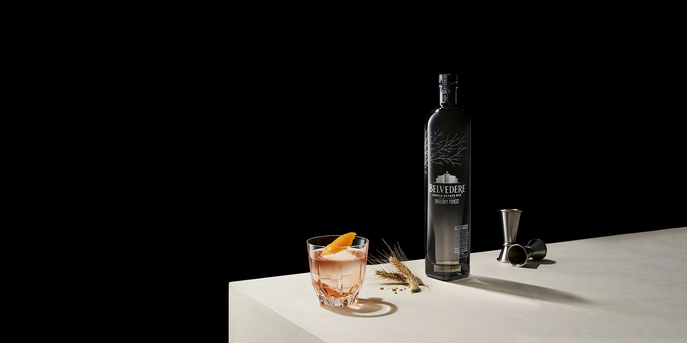 Belvedere vodka with cocktail, jigger, and wheat.