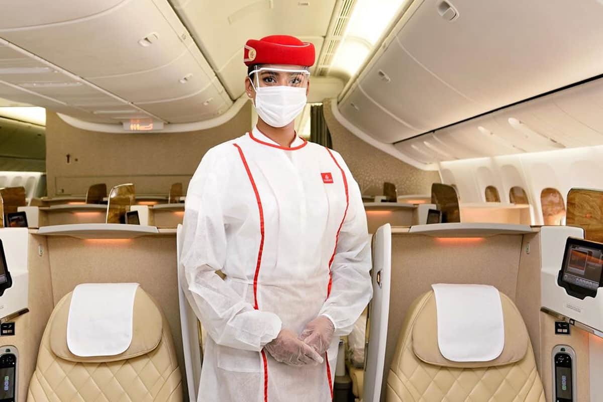 Flight attendant in luxurious airplane.