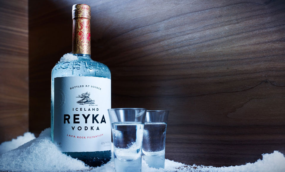 Reyka vodka, shot glasses, snow.
